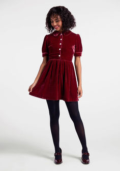 In a deep and plummy shade of red, this stunning velvet shirt dress from our ModCloth namesake label will accentuate your natural glow this holiday season. Made from a plush and drapey woven velvet, this precious mini dress boasts a Peter Pan collar, pearly button-up closure at the front bodice, short puff sleeves with button detailing at the cuff, zip closure at the back, and a gathered empire waistline that gives way to an adorable above-the-knee skirt. Velvet Mini Dress Outfit, Velvet Shirt Dress, Peter Pan Dress, Plus Size Shirt Dress, Pleated Shirt Dress, Red Slip Dress, Statement Outfit, Valentines Day Dresses, Eve Dresses