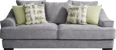 a gray couch with green and white pillows