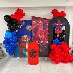 balloons and decorations in the shape of spiderman are on display at a birthday party