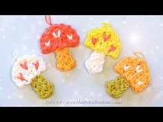 four crocheted mushrooms sitting on top of a table