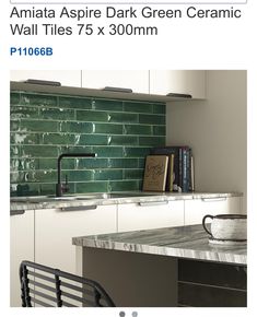 a green tile backsplash in a kitchen