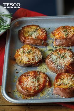 baked stuffed mushrooms with cheese and herbs on a baking sheet