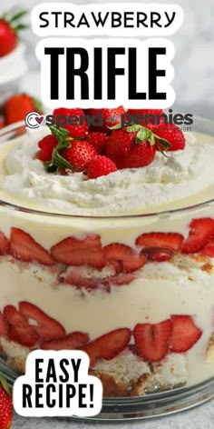 a strawberry trifle is in a glass dish with strawberries on top and the words easy recipe below it