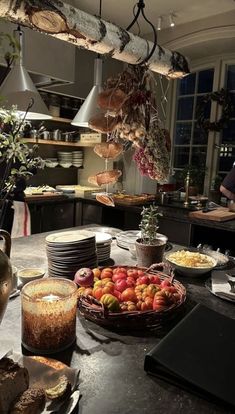 a kitchen filled with lots of food on top of a counter