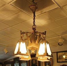 a chandelier hanging from the ceiling in a room