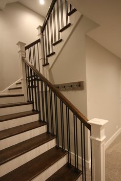 the stairs in this house are made of wood and metal