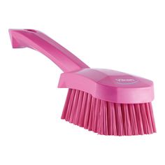 a pink brush on a white background