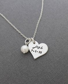 "« Personalized Necklace with Initials and Date // Anniversary Necklace // Hand Stamped Jewelry // Hand Stamped Necklace » Have this pretty heart pendant hand stamped with the initials and date of your choice to make the perfect gift! This necklace makes such a cute gift or keepsake and a cute way to carry a meaningful part of your life with you. The 3/4\" heart and freshwater pearl are hung from an 18\" oval link chain. Please let me know in the 'note to seller' box during checkout with the ini Dainty Hand Stamped Charm Necklace For Anniversary, Dainty Hand-stamped Charm Necklace For Anniversary, Anniversary Dainty Hand-stamped Charm Necklace, Dainty Stamped Charm Necklaces For Anniversary, Dainty Stamped Charm Necklace For Anniversary, Meaningful Heart-shaped Wedding Jewelry, Heart Charm Necklace For Anniversary, Dainty Stamped Necklace For Anniversary, Personalized White Heart Necklace For Wedding