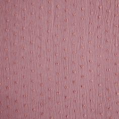 pink fabric with small dots on it