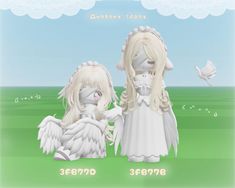 two white angel dolls standing next to each other on a green field with blue sky in the background