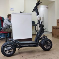 an electric scooter is parked in the middle of a room