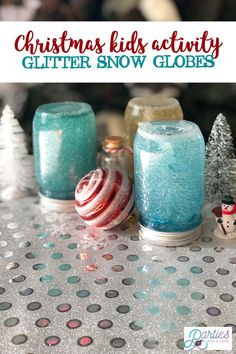 christmas kids'activity glitter snow globes with text overlay that reads, christmas kids'activity glitter snow globes