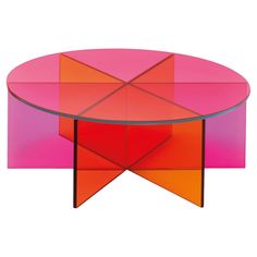 a pink and orange coffee table with geometric shapes