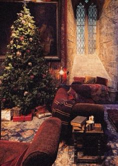 a living room filled with furniture and a christmas tree