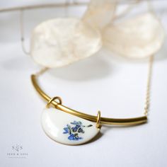 Our Radiance Necklace is the perfect balance of modern and minimal. Choose from a white or black background with complementing botanicals: Queen Anne’s Lace is a symbol of sanctuary. Forgetmenot is a symbol of remembrance, lasting friendship, and love. Bar and pendant are solid brass. 20" gold plated chain. All pieces are tarnish resistant. However, we recommend visiting our care section for more info on keeping your jewelry beautiful. All pieces are nickel and lead free. Ships in a jewelry gift Jewelry Looks, Botanical Jewelry, Timeless Aesthetic, Jewelry Beautiful, Stunning Jewellery, Forget Me Not, Queen Anne, Gold Plated Chains, Perfect Gift For Her