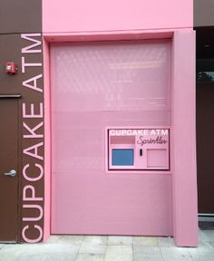 a pink door with the words cupcake atm on it