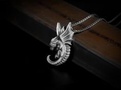 Winged baby dragon pendant necklace for men or girlfriend, Silver cute mythology jewelry, Cute baby dragon gift for women, Girlfriend gifts The wearer of dragon pendant can feel courage, strength, protection and even good luck! Some say that wearing a dragon necklace helps to protect one's most precious treasure, the heart. Although the dragon symbolizes the power and might of the wearer, it also repels those whose energy is unwelcome.  This winged baby dragon necklace features exclusive handmad Cute Baby Dragon, Mythology Jewelry, Dragons Gift, Jewelry Cute, Dragon Necklace, Baby Dragon, Dragon Pendant, Polish Silver, Necklace For Men