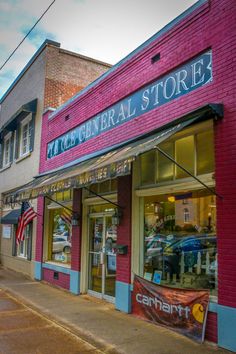 a store front with an american flag in the window