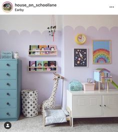 a child's room with toys and decor on the walls