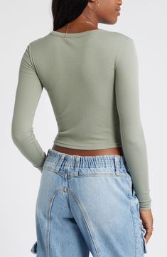 Svelte and stretchy, this finely ribbed crop top is the perfect match for high-rise styles and is polished off by a graceful scoop neckline. 17 1/2" length (size Medium)   Scoop neck   Long sleeves   97% Lenzing™ EcoVero™ viscose, 3% spandex   Lenzing EcoVero viscose is a sustainably produced fiber using pulp made from renewable wood sources and certified with the EU Ecolabel for high environmental standards, including lower emissions and water usage than generic viscose   Machine wash, dry flat Solid Color Crop Top For Fall, Spring Cropped Tops With Ribbed Neckline, High Stretch Solid Color Crop Top For Spring, Fitted Cropped Top In Solid Color, Fitted Cropped Top, Ribbed Fitted Crop Top, Fitted Solid Color Crop Top For Spring, Basic Cropped Elastane Tops, Spring Solid Color Fitted Crop Top