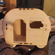 a wooden model of a camper made out of plywood and some sort of wood