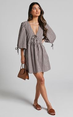 Rosita Mini Dress - Tie Front Puff Sleeve Dress in Brown and White Check Trendy Puff Sleeve Dress For Day Out, Trendy V-neck Mini Dress For Daywear, Casual Puff Sleeve Dress For Fall Daywear, Casual Puff Sleeve Dress For Daywear In Fall, Fall Puff Sleeve Mini Dress For Day Out, V-neck Puff Sleeve Dress With Ruched Detail, Fall Mini Length Puff Sleeve Dress, Spring Vacation V-neck Puff Sleeve Dress, Chic V-neck Dresses For Picnic