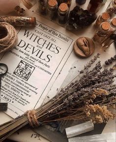 the contents of witches and devils are laid out on top of an old paper with scissors