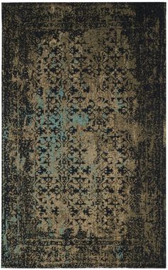 an area rug with various colors and patterns on it, including blue, green, brown and black