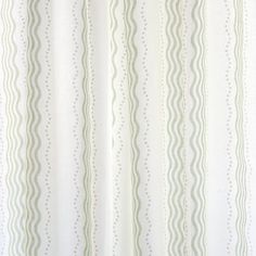 a white curtain with wavy lines on it