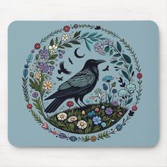 a black bird sitting on top of a flowery plant mouse pad with flowers and birds in the background