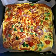 a square pizza sitting on top of a pan covered in cheese and veggies