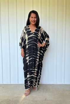 This kaftan, made from rayon fabric and hand dyed, is versatile for many occasions. It complements all body types with its long, hangs loose design and slits up both sides. It can be worn in many different stylish ways to make you look your best! DETAIL • All measurements are flat• Bust/ Waist/ Hips 34 in. (Circumference 68 in.)• Arms 11 in. (Circumference 22 in.)• Length 50 in. The model wear • V-Neck • Side slits• No pocket• Slipover style• All above measurement are flatFABRIC• 100% Rayon FIT• Unique Tie Dye, Tie Dye Pattern, Hang Loose, Black Tie Dye, Kaftan Dress, White Tie, Rayon Fabric, Look Your Best, Black Tie