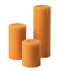 three orange candles sitting next to each other