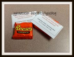 two pieces of candy sitting next to each other on top of a table with paper