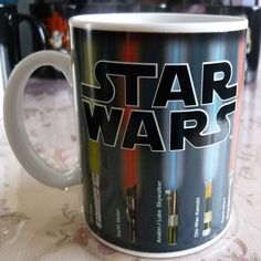 a star wars coffee mug sitting on top of a table