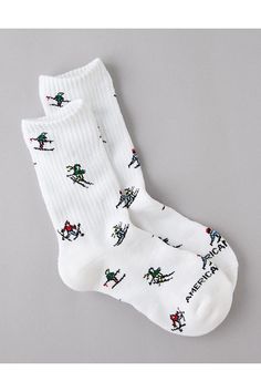 Made from soft cotton/Ribbed cuff/Holiday-inspired pattern White Casual Socks With Ribbed Cuffs, Casual White Socks With Ribbed Cuffs, Casual Cotton Socks For Winter, Cotton Socks With Ribbed Cuffs, Cozy White Cotton Socks, Playful White Winter Socks, Winter Cotton Socks With Ribbed Cuffs, Crew Socks, American Eagle Outfitters