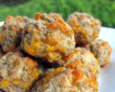 a close up of food on a plate with words above it that reads cream cheese sausage balls