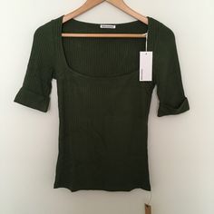 Reformation Leanne Knit Top In Fern Green Sz M Square Neck Ribbed Tencel Modal Soft Stretchy Brand New With Tags. Made In Usa. Comes In Original Reformation Packaging. Armpit To Armpit: 15 1/4 Length (Shoulder Seam To Hem): 23 Top It Off. The Leanne Is A Fitted Top With A Square Neckline. It Features Short Sleeves And Can Be Worn Day-To-Night If You Ask Us. It's Soft And Stretchy For An Extra Comfortable Feel. The Leanne Knit Top Pairs Well With The - Fitted Bodice - Knit Fabric - Short Sleeve - Fitted Green Ribbed Knit Top, Chic Green Fine Knit Top, Fitted Green Fine Knit Tops, Fitted Fine Knit Green Tops, Fern Green, Square Neck Top, Fitted Top, Fitted Bodice, Half Sleeve