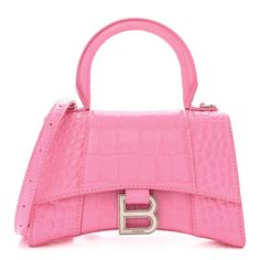 This is an authentic BALENCIAGA Shiny Calfskin Crocodile Embossed Hourglass Top Handle Bag XS in Baby Pink. This stylish and structured handbag is crafted of crocodile embossed in pink calfskin leather. The bag features a sturdy leather top handle with ruthenium links and a prominent B logo on the front flap, and an optional, adjustable shoulder strap. The front flap opens with a magnetic snap closure to a smooth pink leather compact interior. Balenciaga Hourglass Bag, Balenciaga Top Handle Bag, Crossbody Bag Fashion, Balenciaga Handbags, Balenciaga Bag, Chain Crossbody Bag, Handle Bag, Bag Fashion, Pink Bag