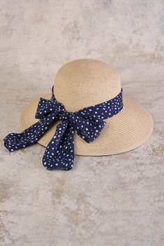 This summer accessory is fashion made easy, bringing a Parisian touch to a classic sunhat design with a polka dotted ribbon in navy and white. Perfect for your next outdoor event or beachside holiday, this sunhat with a subtle gold metallic weave, is crafted from polypropylene braid and straw in a neutral shade that will easily pair with your everyday looks. Outdoor Event, Ribbon Trim, Summer Accessories, Sustainable Clothing, Velcro Straps, Winter Wear, Grosgrain Ribbon, Travel Style, Sun Hats