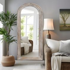 a living room filled with furniture and a large mirror