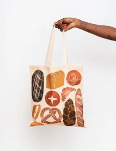 a person holding a bag with different types of food on it and the bottom half is white