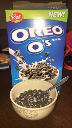 cereal is in a bowl and next to a box of oreo's cereal