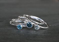 Deep Sea Stacking Rings London Blue Topaz Swiss Blue by KiraFerrer Handmade Blue Topaz Rings In Blue, Silver Rings With Blue Topaz And Polished Finish, Silver Blue Topaz Ring With Polished Finish, Aquamarine Stacking Ring, Blue Topaz Ring In Sterling Silver, Fine Jewelry, Cast Rings, Silver Blue Topaz Gemstones, Round Shape, Sterling Silver Stacking Rings, Stacking Ring Set