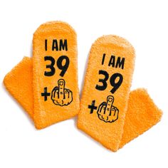 two yellow hand towels with the words i am 39 and thumbs up written on them