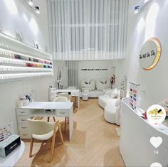 the interior of a nail salon with lots of white furniture and accessories on display,