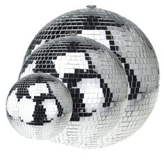 three shiny disco balls with black and white designs