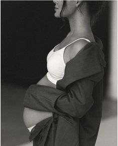 black and white photograph of a pregnant woman