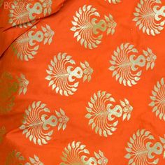 Indian Orange Banarasi Brocade Bridal Wedding Dress by the Yard Brocade Banaras Blended Silk jacket Bridesmaid Skirts Table Runner fabric. This is beautiful Varanasi brocade fabric in twin shade, brocade fabric has large motifs design in Orange and Gold.  ➤Product: Brocade Fabric ➤Fabric Type: Blended Silk (Viscose and Silk) Fine quality Zari Brocade Weaving from Banaras ➤Color: Orange and Gold ➤Width: 44 inches. ➤Condition: New  ➤Code: bg499 ➤Listing for 1 Yard of fabric. ➤Care: Dry Clean Only You can use this fabric to make Dresses, Tops, Blouses, Jackets, Crafting, Clutches or Evening Bags, Embellish your clothes, Pillows, Drapery, Home Décor, Outdoor, Quilting, Sewing, General, Upholstery etc use it for scrap booking projects. If you purchase more than 1 Yard you will get it in running Wedding Fabric With Motifs For Navratri, Orange Wedding Blouse Piece With Traditional Patterns, Wedding Orange Blouse Piece With Traditional Patterns, Gold Brocade Choli For Traditional Ceremonies, Orange Brocade Traditional Wear For Festive Occasions, Wedding Orange Zari Weaving Set, Orange Wedding Sets With Zari Weaving, Wedding Orange Set With Zari Weaving, Orange Wedding Set With Zari Weaving