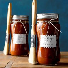 three jars filled with different kinds of sauce